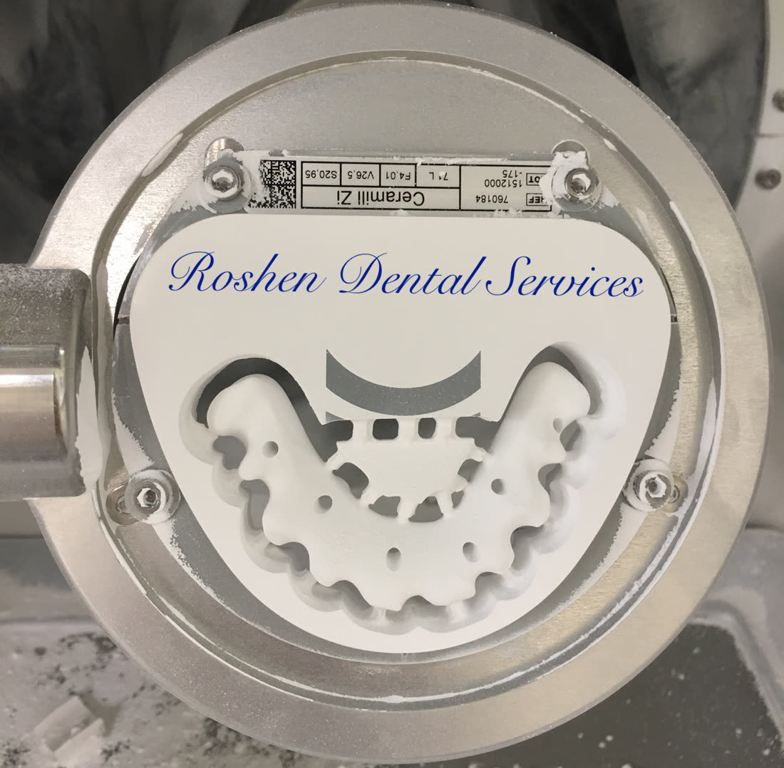 Milled zirconia framework in the CNC chamber at Roshen Dental Lab